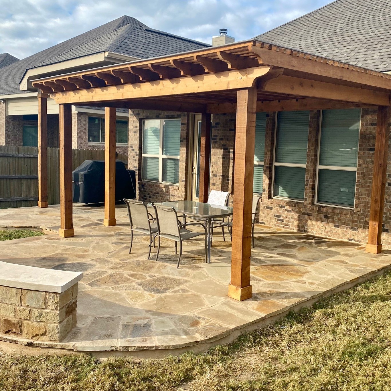 Stone patio with pergola